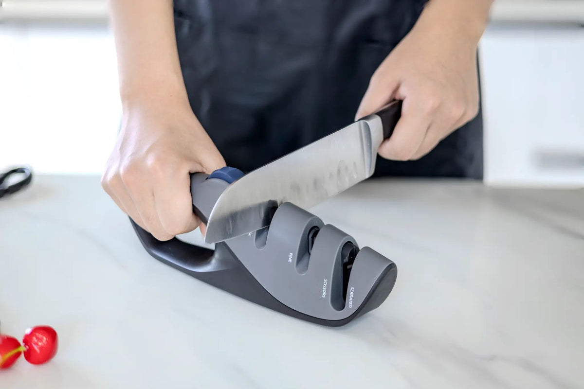 ZUKU R066 — lifestyle shot chef sharpening kitchen knife